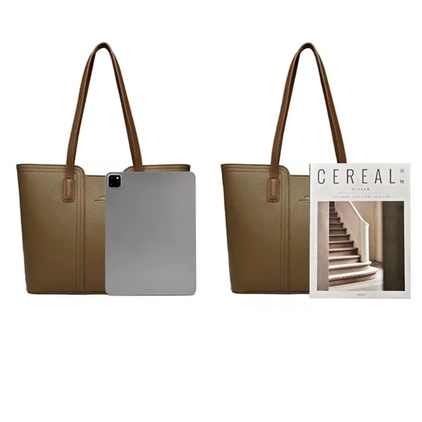 Detaljerad vy av brun shopperväska för dam. Sidor, botten och sömmar visar robust hantverk och slitstarkt material.