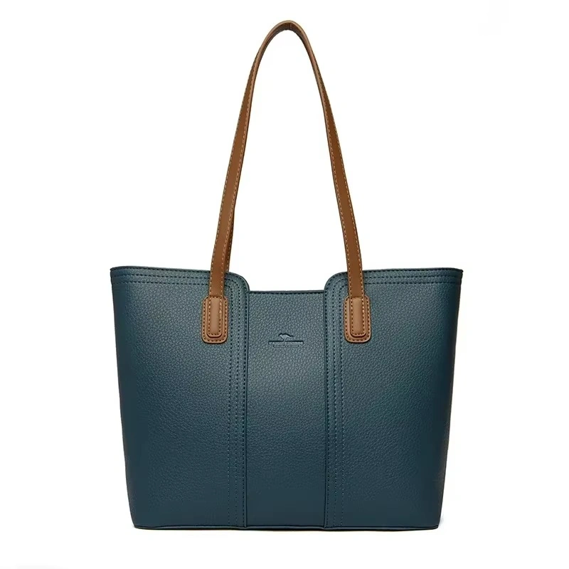 Elegant blå shopperväska för dam med långvarig kvalitet. Stängs med dragkedja och rymmer laptop, böcker och vardagliga accessoarer.