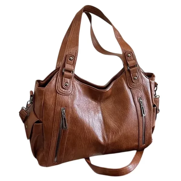 Ljusbrun axelremsväska i vintage-look, tillverkad i slitstarkt PU-läder. Elegant och funktionell för både jobb och fritid.